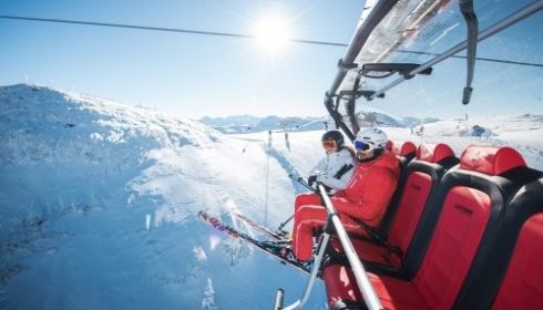 empty red chair lift in Kitzbühel Austria
