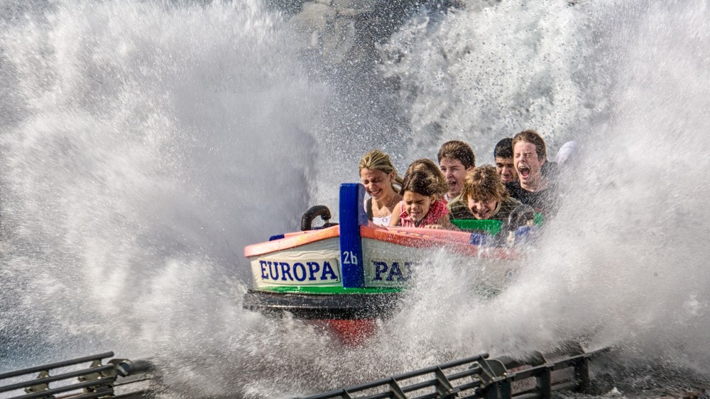 kids on water ride in theme park on road trip
