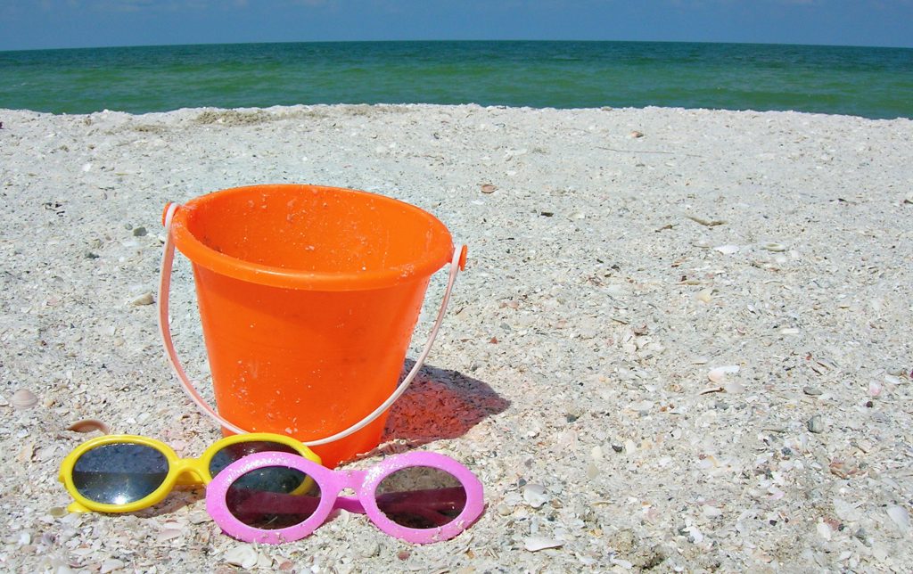 holiday with kids - sun glasses and bucket