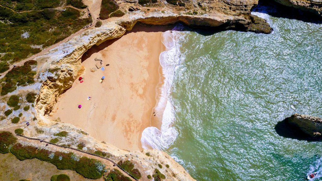 visit a beach in the Algarve