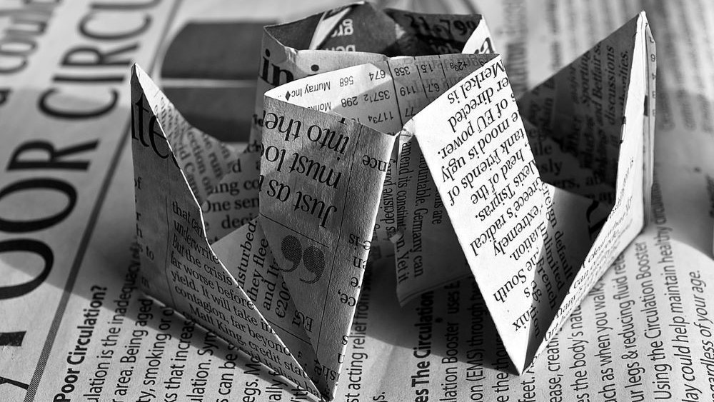 single parent benefits and money saving tips - re-use old newspaper for craft