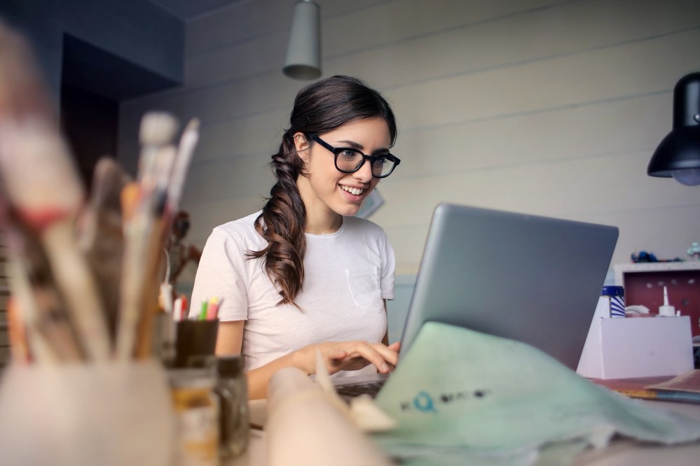 why do flight prices change - woman on laptop