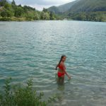 child swimming in Lake Barcis