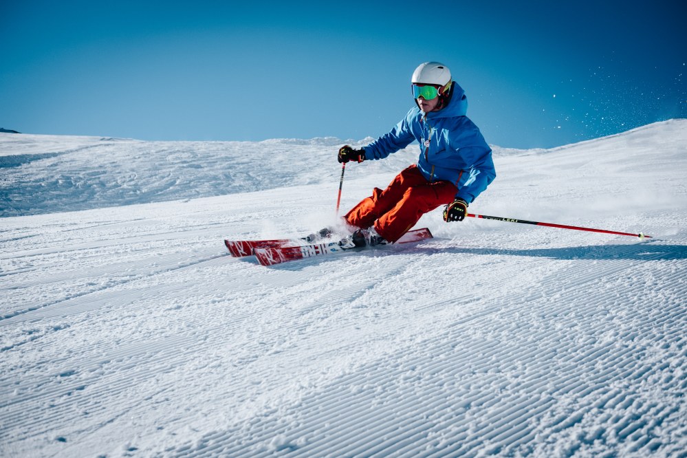 skier in action - ski holiday packing list