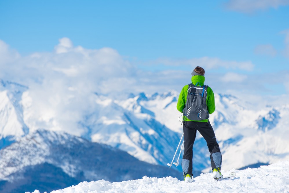 skier with rucksack for ski holiday packing list