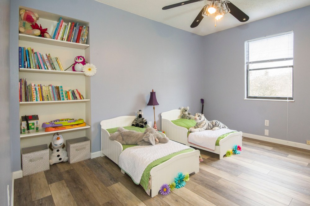 cool kids bedroom with two kids beds and shelf