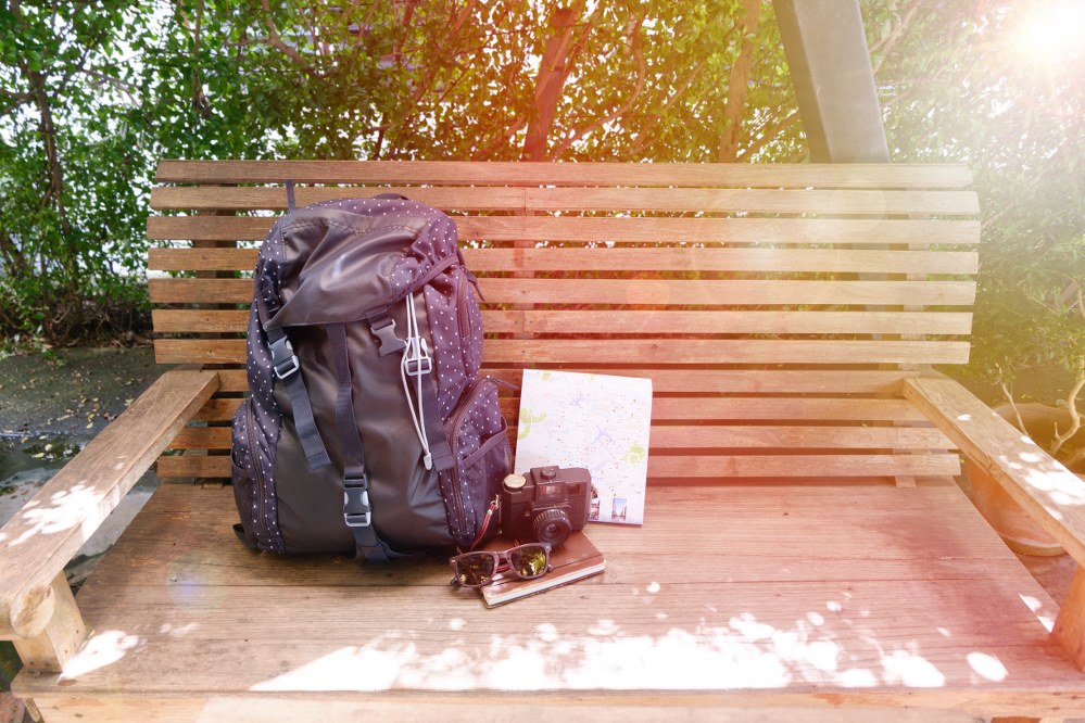 hand luggage travel rucksack on bench