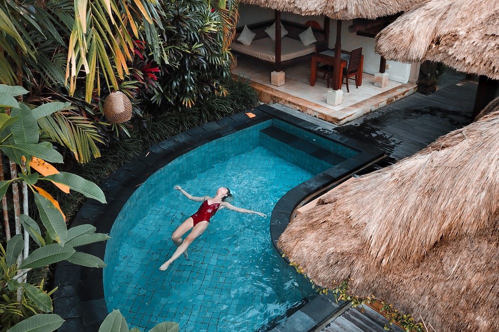 single mum relaxing on her own in pool