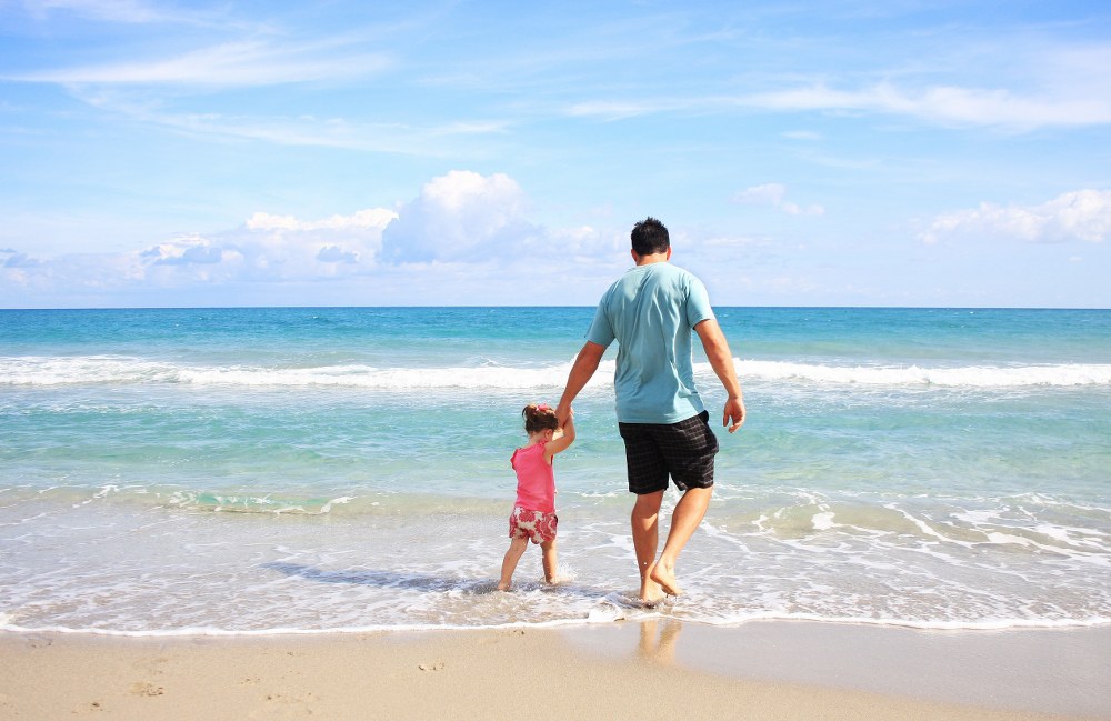 single parent with child on beach on Mykonos