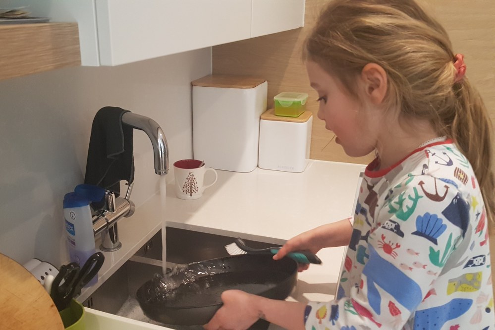 girl helping with washing up