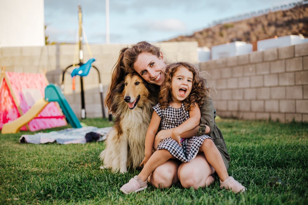 single parent with daughter and border collie