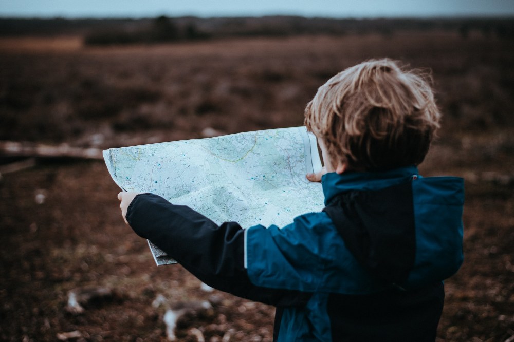 child holding map in South of England
