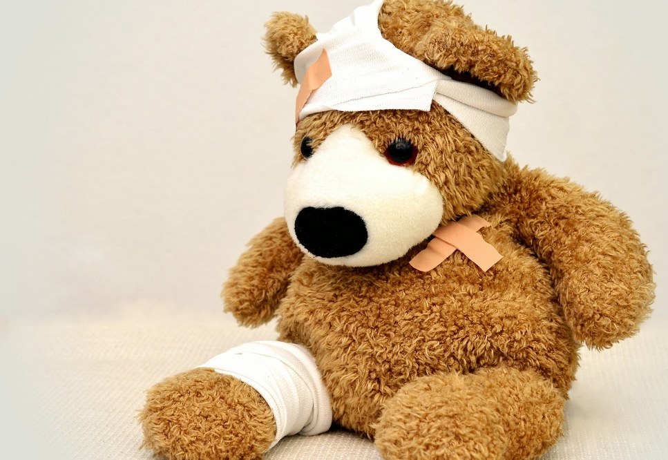 injured teddy with plasters