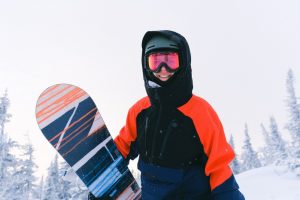 teenager with snowboard on holiday