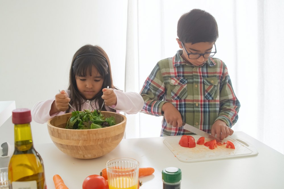 children chopping vegetables