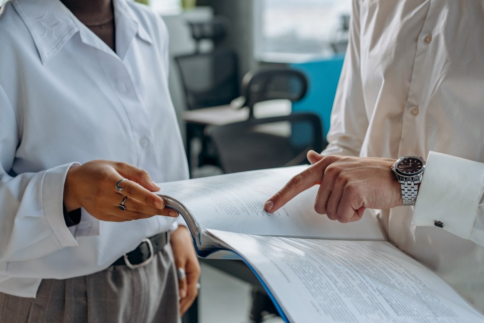 woman and man looking at insurance papers