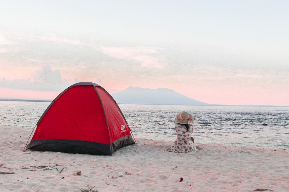 woman outside beach tent on holiday