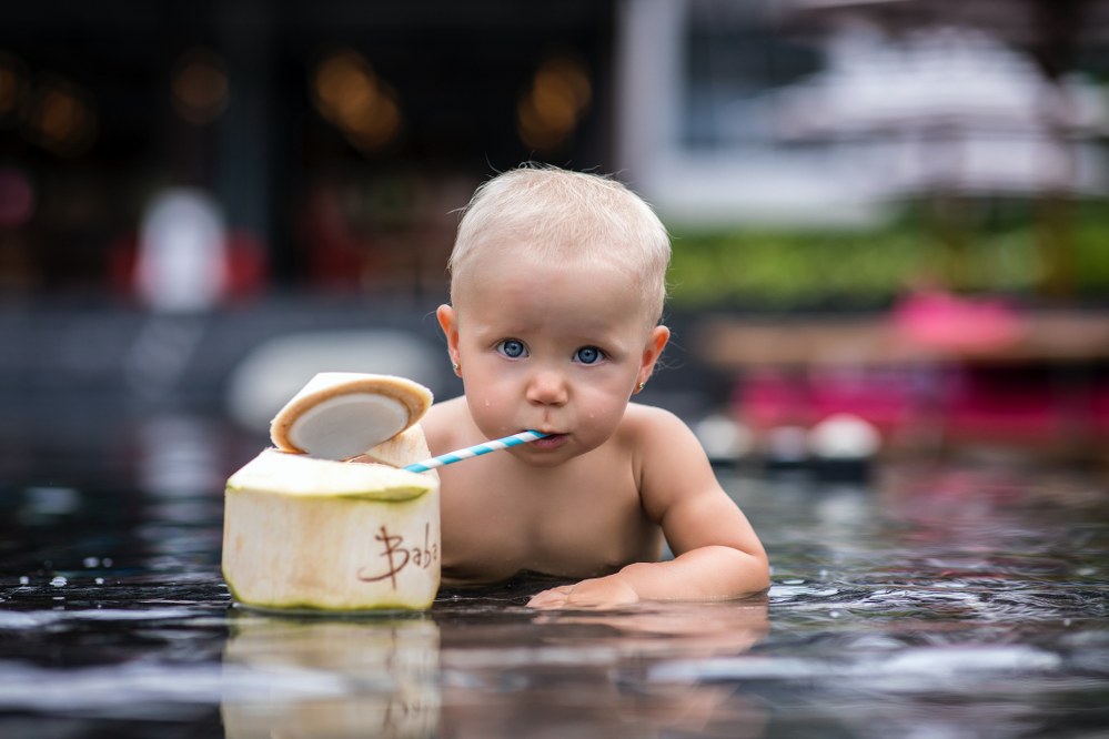 toddler drinking coconut milk