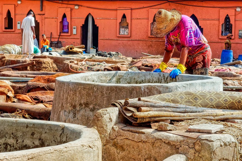 craftsmen dyeing fabrics in Marrakech souks