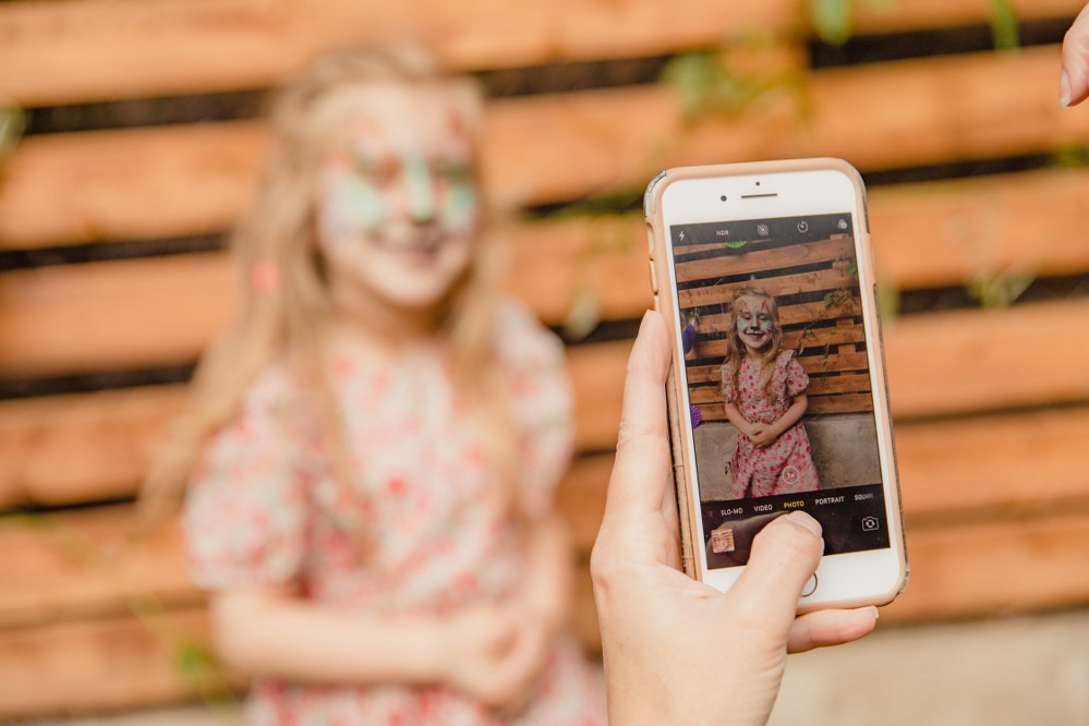 stay secure online when travelling with kids taking photos on holiday