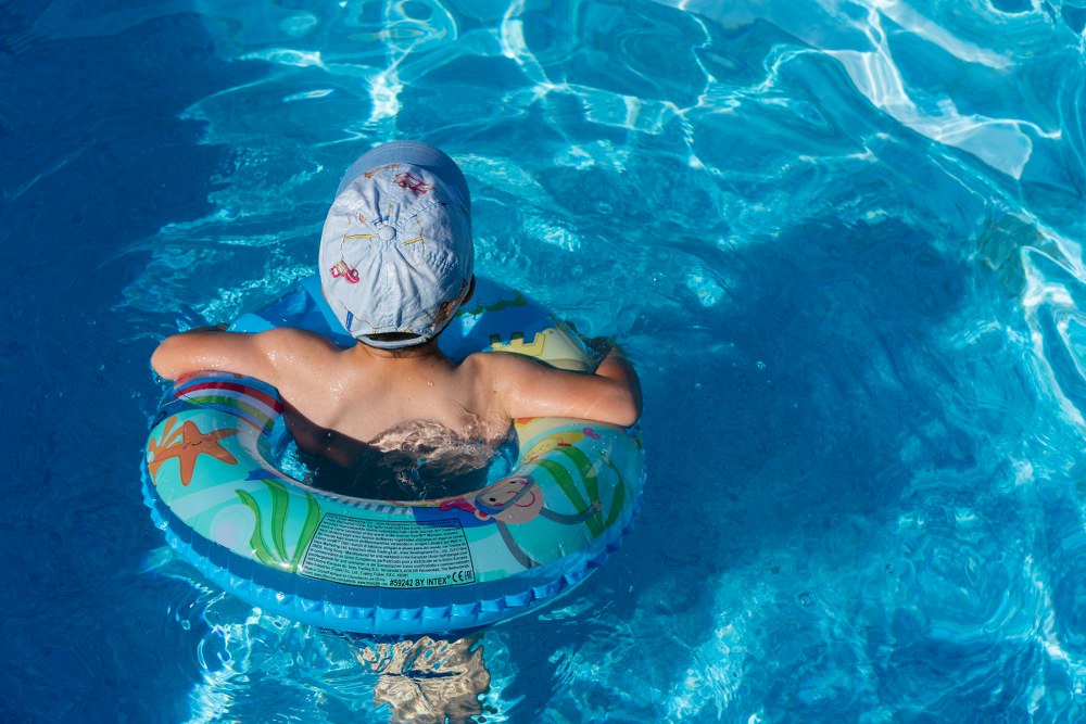 boy in swimming pool at static caravan site