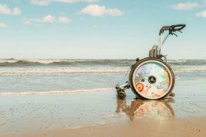 accessible family holidays - kids wheelchair on the beach