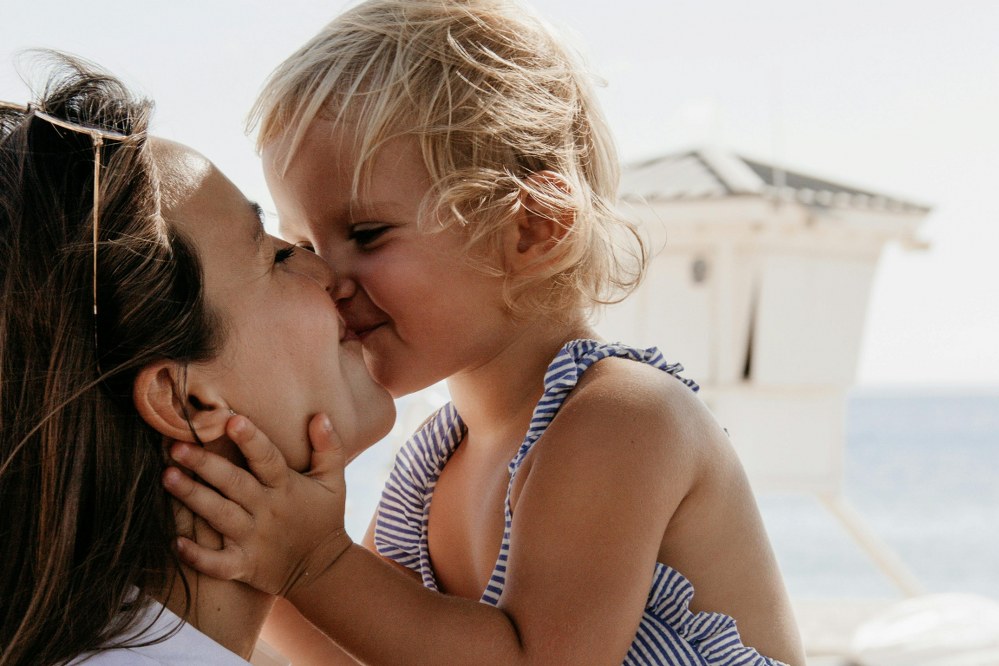 mother and girl on beach