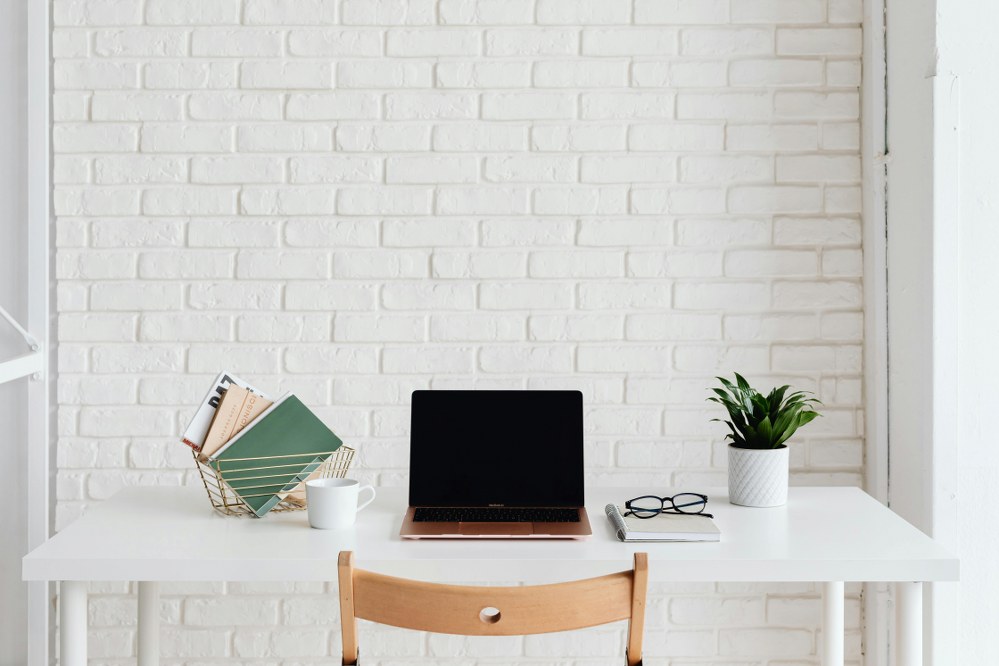 the best office furniture for small spaces: folding chair and wall mounted desk