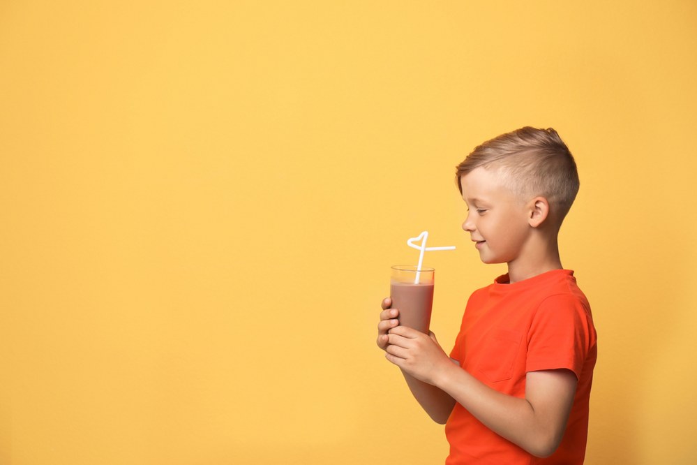 kid dinking protein shake