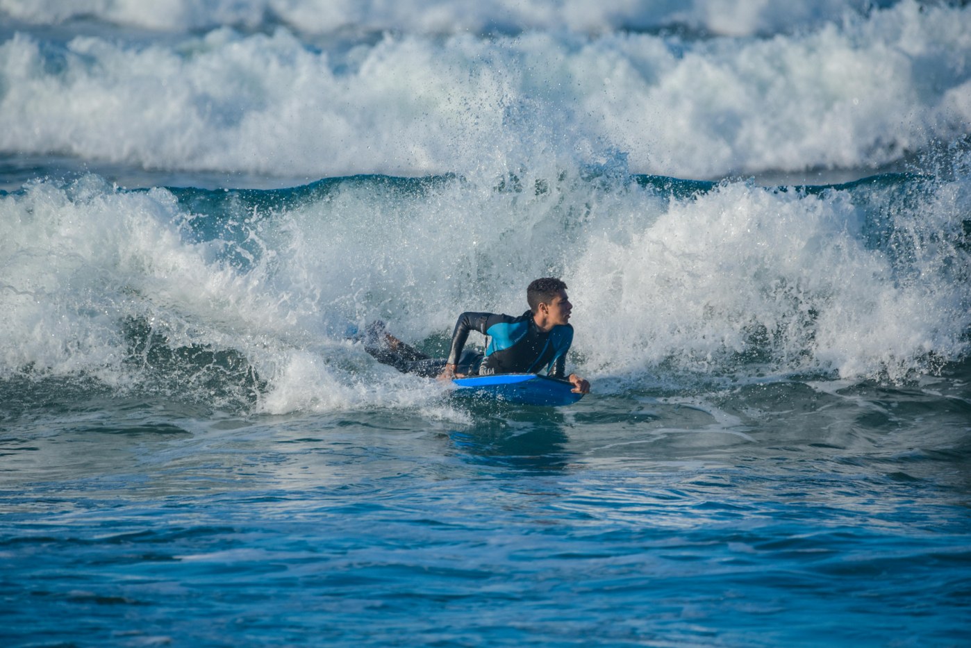 teenager surfing on holiday