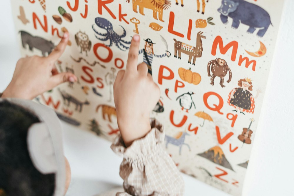 child learning to read with the alphabet