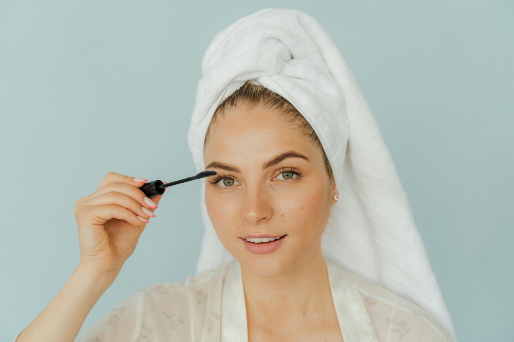 woman applying mascara
