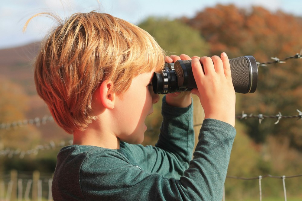 child with binoculars
