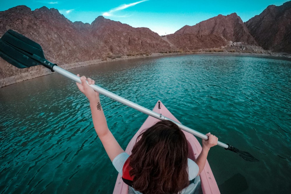 girl kayaking in Hatta, Dubai