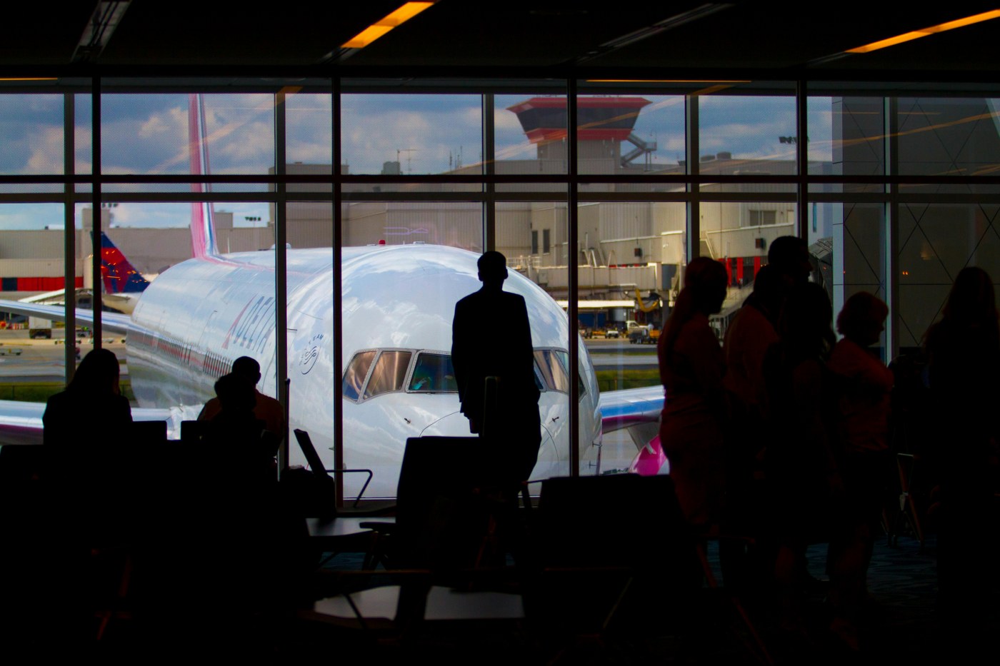passengers waiting to board a delayed flight