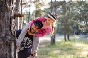 single dad and daughter positing for family photo